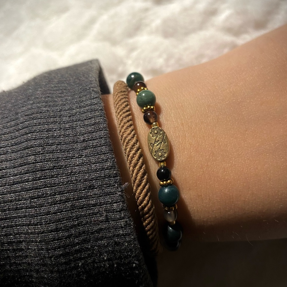 Green and amber beaded bracelet with gold accents